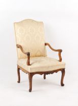 Property of a lady - an 18th century French Louis XV carved fruitwood fauteuil, with cabriole legs.