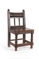 Property of a lady - a 17th century Spanish carved walnut side chair, with panel seat.