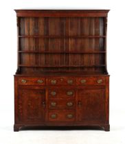 Property of a lady - a George III oak two-part Welsh dresser, the base with an arrangement of six