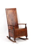 Property of a lady - an early 19th century fruitwood lambing chair, with through drawer, on turned