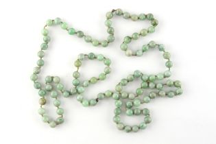 Property of a gentleman - a late 19th / early 20th century Chinese jadeite bead necklace, the