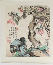 A Chinese scroll painting on paper depicting flowers and rockwork, signed with calligraphy and seven