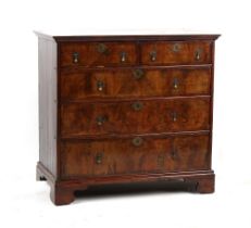 Property of a lady - an early 18th century George I walnut chest of two short & three long graduated