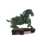 Property of a lady - a Chinese Tang style carved nephrite jade model of a horse, the base re-