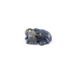 A Chinese carved lapis lazuli model of a Recumbent Buffalo, 2.2ins. (5.6cms.) long.
