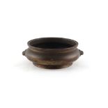 A Chinese bronze two handled censer, of squat bombe form, 18th century, apocryphal Xuande 6-