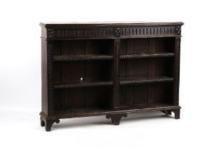 Property of a lady - a late Victorian carved dark oak dwarf open bookcase, with four adjustable