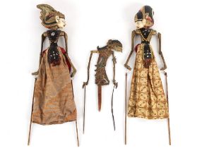Property of a lady - three Indonesian painted wood wayang kulit puppets, the tallest approximately