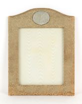 Property of a lady - an early 20th century Chinese carved pale celadon jade plaque, 2.75ins. (7cms.)