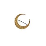 Property of a lady - an unmarked gold (tests 15ct) crescent brooch, the pin steel, approximately