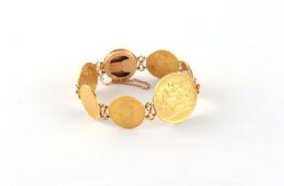 Property of a lady - an unmarked 18ct yellow gold (tested) coin bracelet, the seven coins comprising