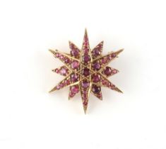 A 9ct yellow gold ruby star brooch, the round cut rubies weighing a total of approximately 4.20