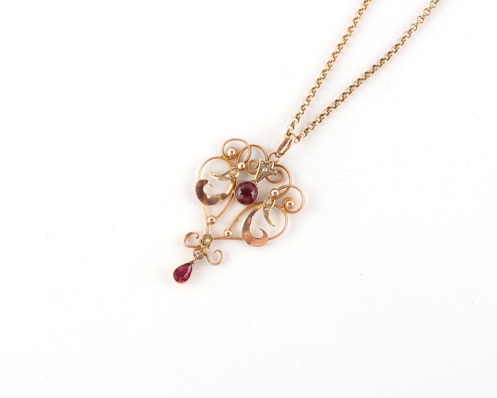 Property of a deceased estate - an Edwardian 9ct gold pendant set with red stones & seed pearls,