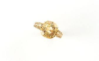 An 18ct yellow gold yellow sapphire ring, the large octagonal cut yellow sapphire weighing