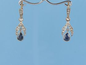 A pair of Belle Epoque sapphire & diamond earrings, the two pear shaped cut sapphires weighing