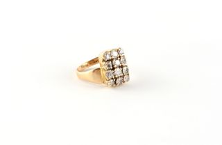 Property of a deceased estate - a modern 18ct yellow gold diamond rectangular panel ring, the twelve