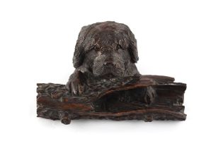 Property of a lady - a late 19th century Black Forest carved dog's head inkwell, with glass liner,