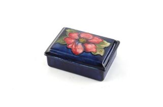 Property of a deceased estate - a Moorcroft Anemone pattern rectangular box, 4.75ins. (12cms.) long.
