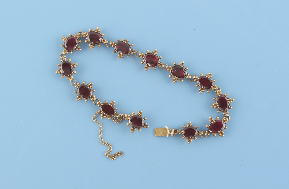 An early 19th century late Georgian yellow gold (tests 18ct) oval cut garnet bracelet, with closed - Image 2 of 3