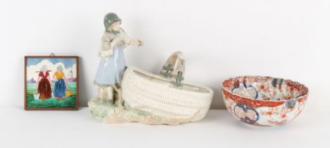 Property of a lady - an Austrian Amphora porcelain model of a girl with large basket, 12.3ins. (31.