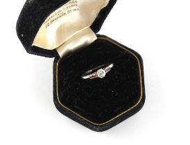 Property of a gentleman - a platinum diamond & ruby ring, the round brilliant cut diamond weighing