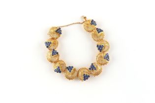 Tiffany & Co. - an 18ct yellow gold link bracelet set with round cut sapphires, the estimated