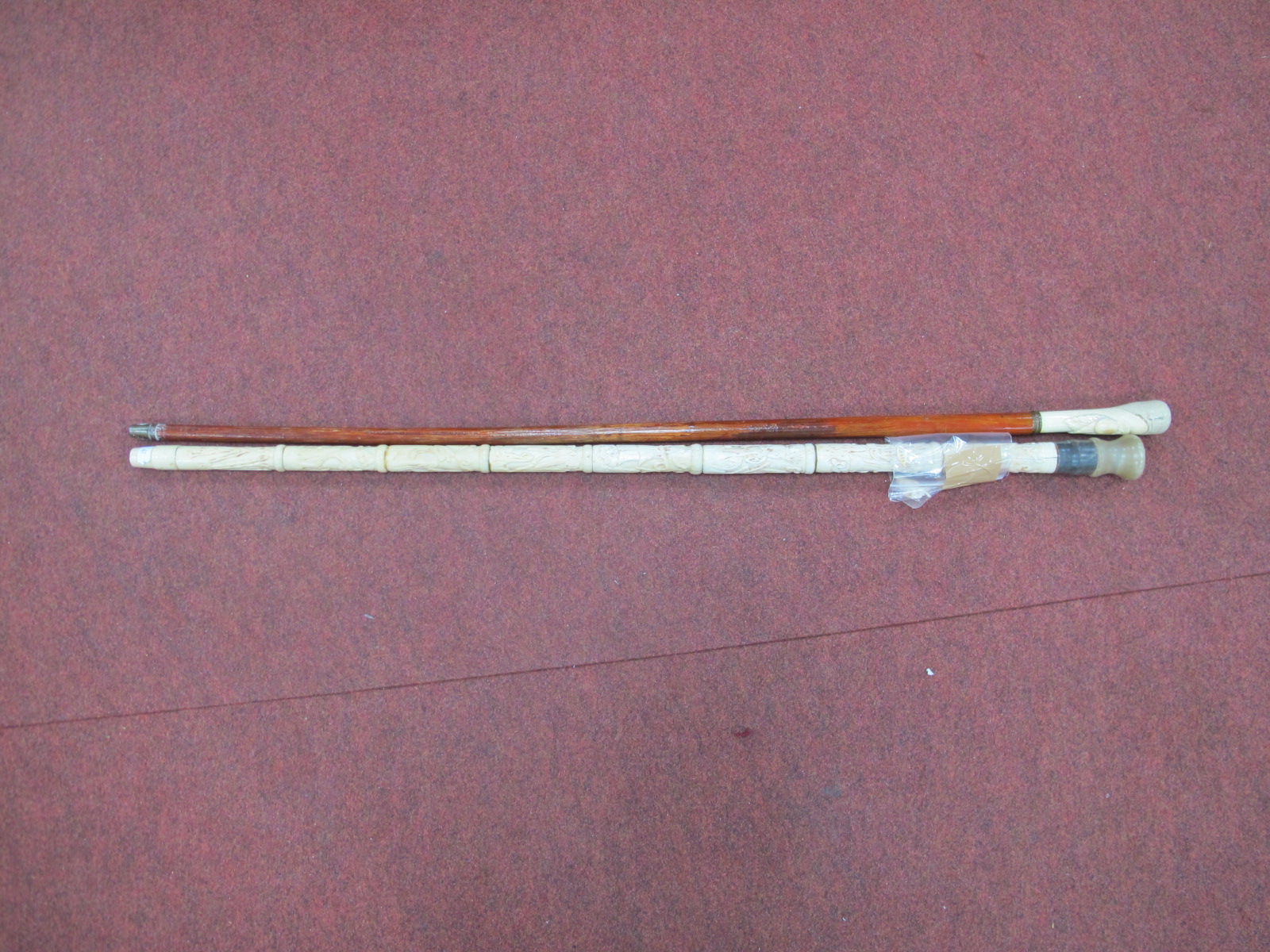 A Bone Sectional Walking Cane with Oriental Figures, polished horn handle 85cm long, plus bone