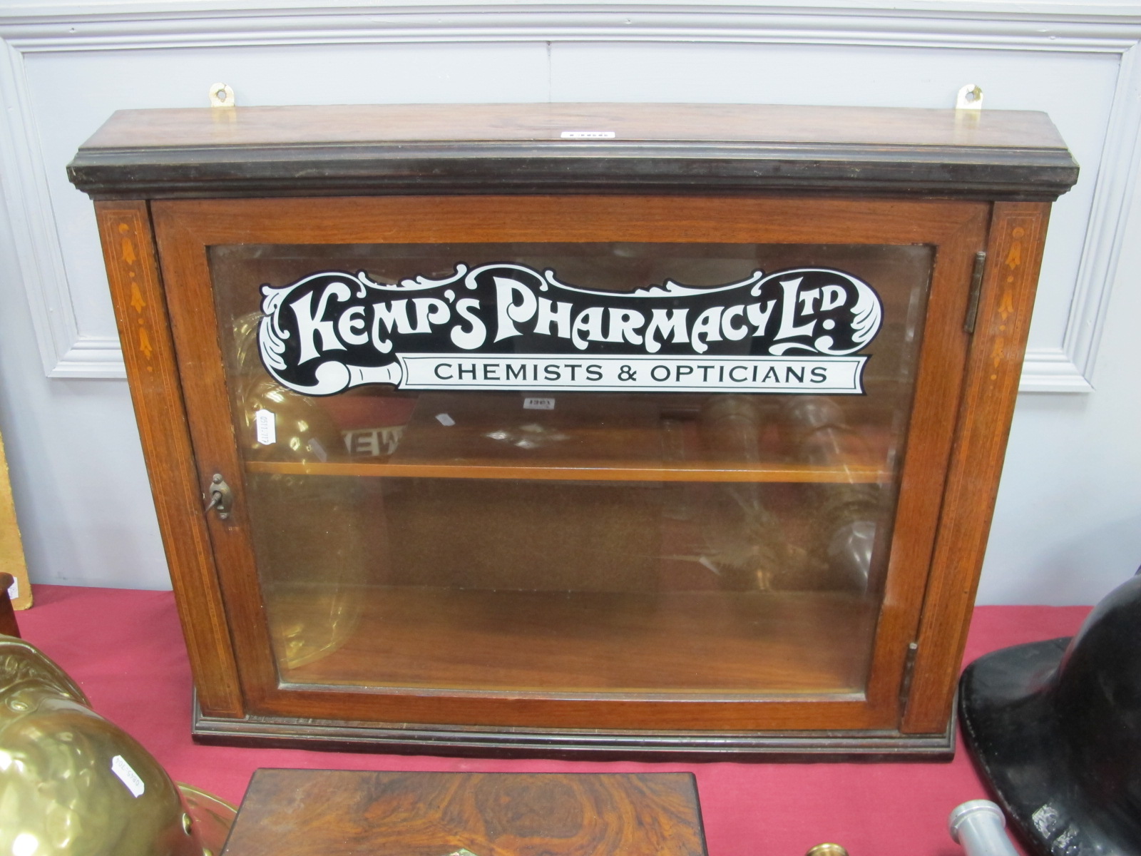 An Edwardian Mahogany Shop Cabinet, bearing later label "Kemp's Pharmacy", 74cm wide.