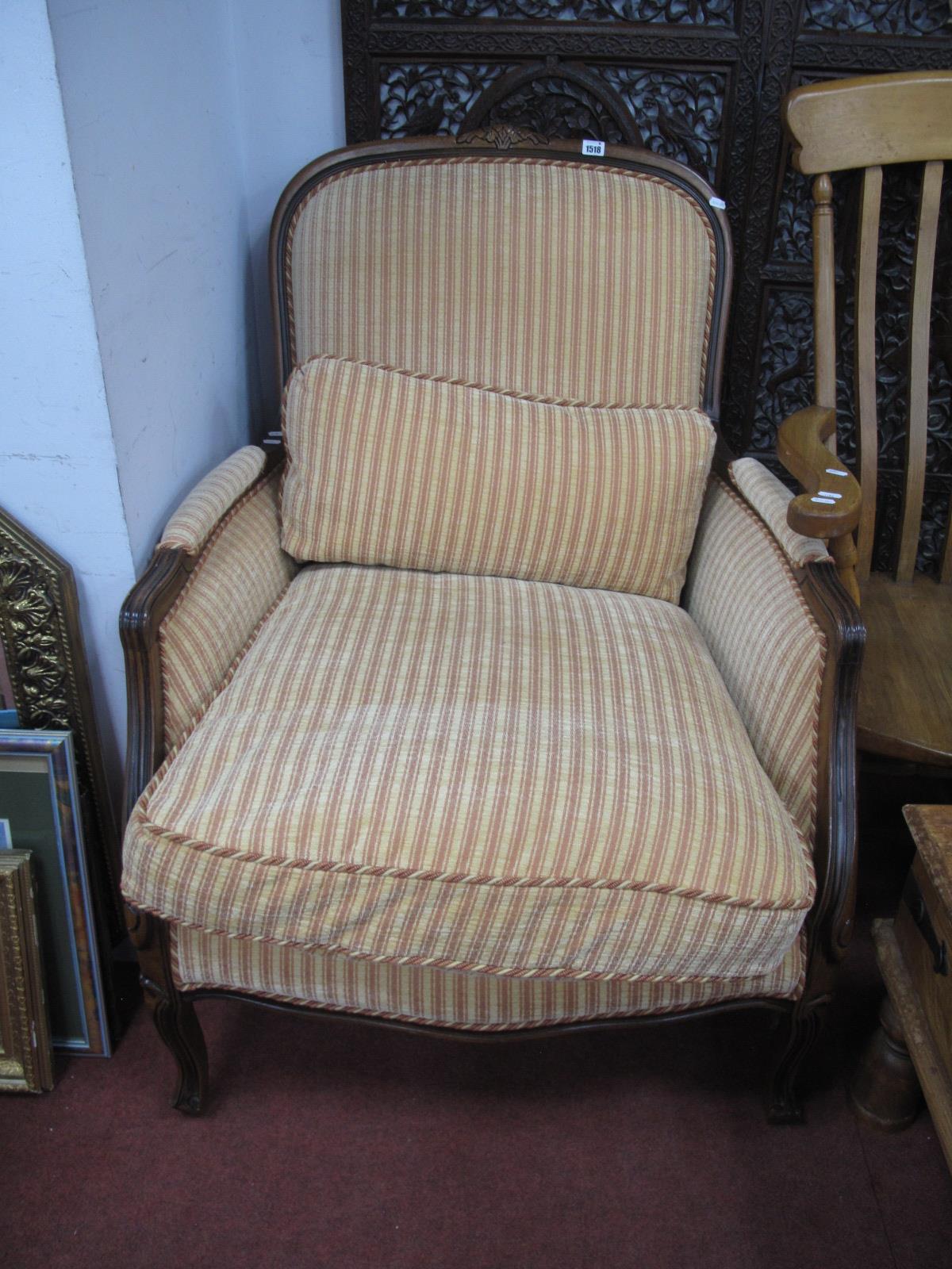 A French Style Armchair, with upholstered back arms, seat on cabriole legs