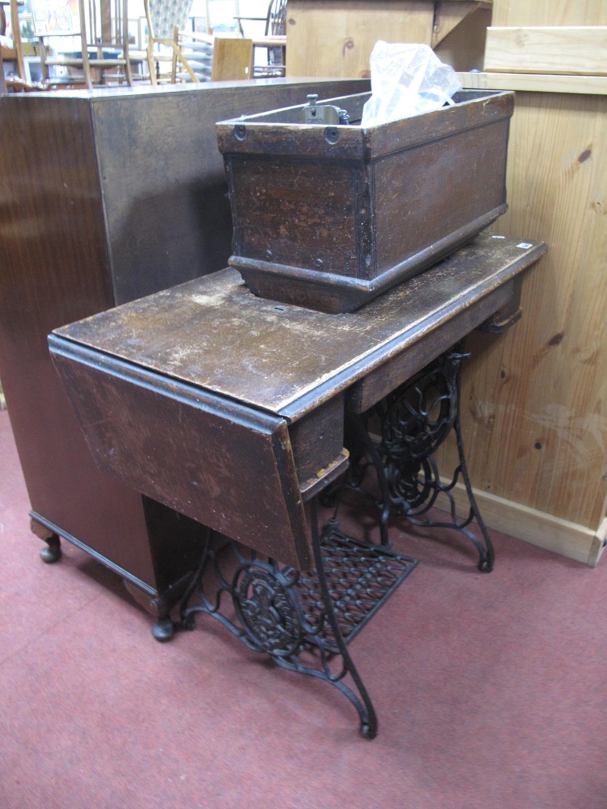 A Singer Treadle Sewing Machine.