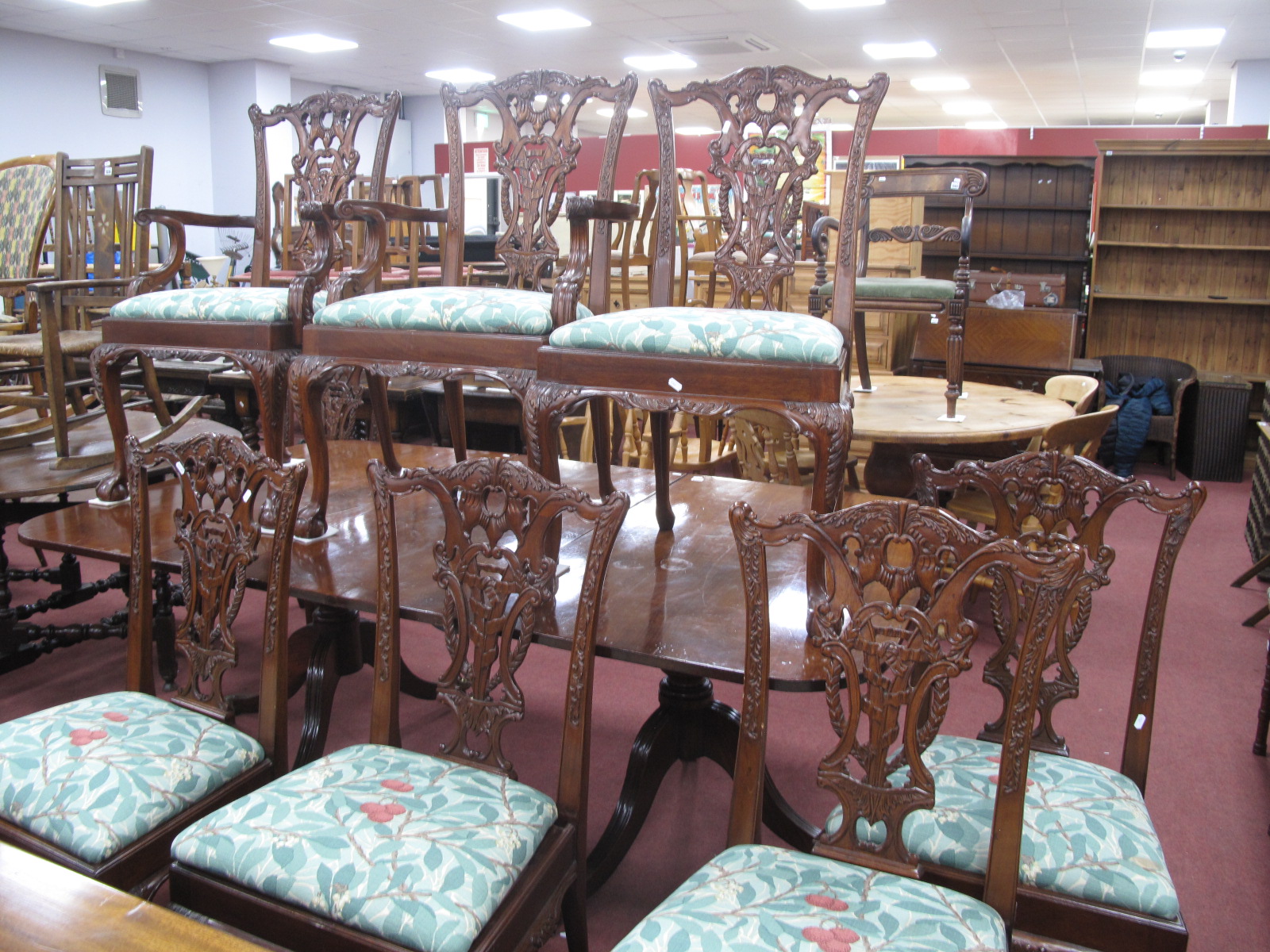 A Set of Eight Chippendale Style Mahogany Dining Chairs, (two arm chairs, six single), with a shaped