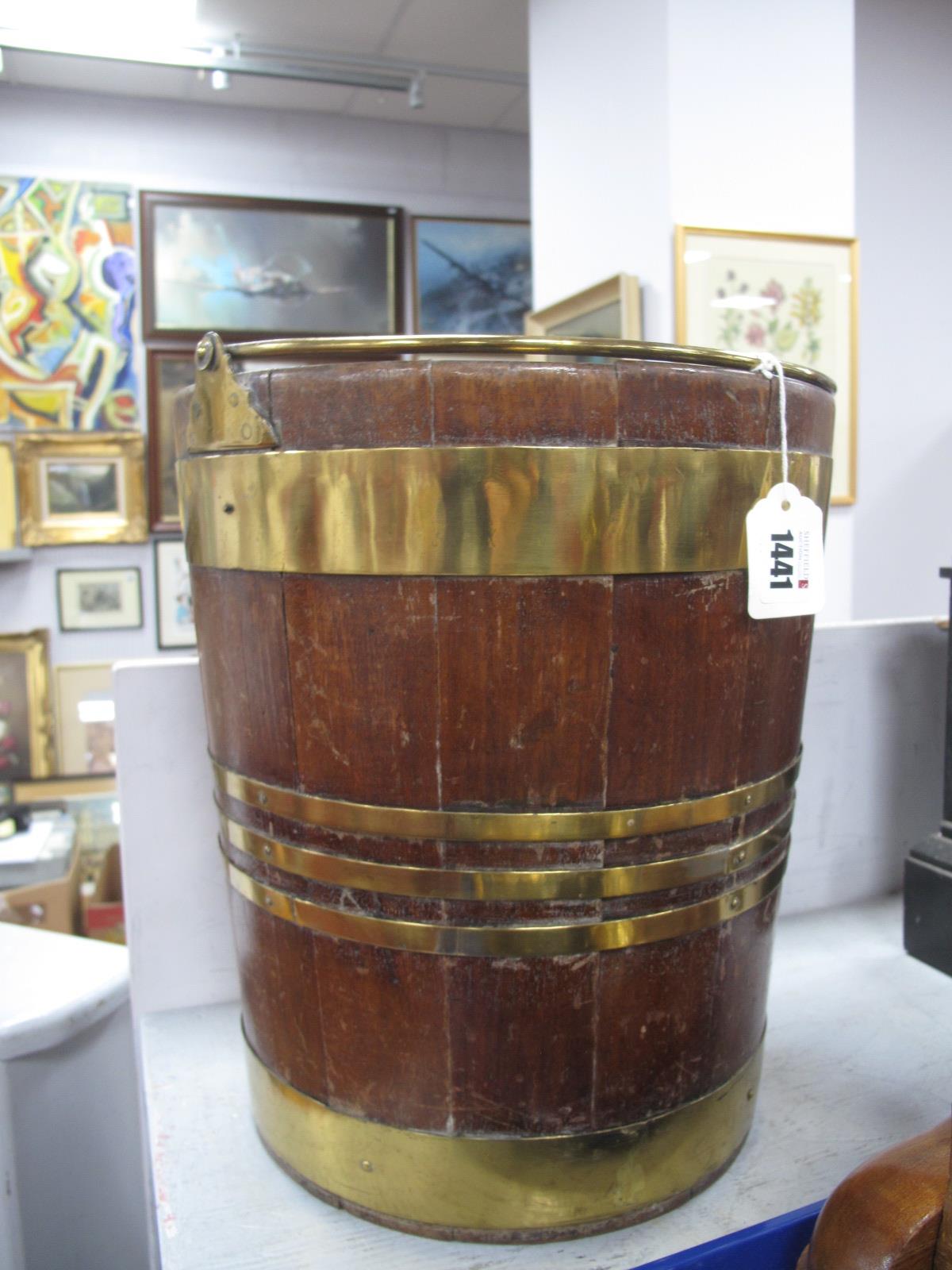 A XIX Century Mahogany Bound Peat Bucket, of coopered construction, 34cm high.