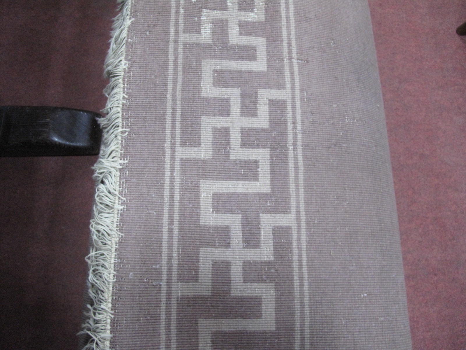 A Chinese Wool Tassled Carpet, with floral motifs, within Swastika border, on brown ground, no - Image 4 of 5