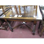 A 1930's Oak Draw Leaf Dining Table, on barley twist supports, and block supports with X stretcher.