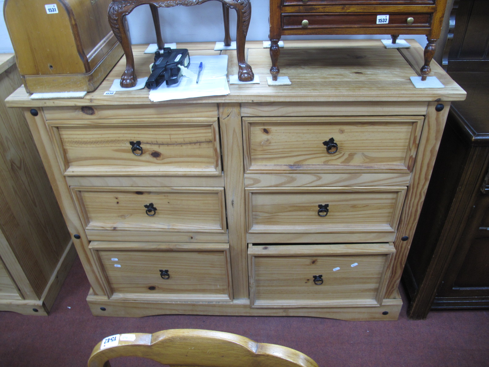 A Pine Chest of Drawers, with six small drawers, on shaped plinth base, with stud decoration,