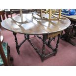 An Early XVIII Century Joined Oak Gate Leg Table, with an oval top, single drawer, on turned and