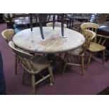 A Pine Circular Topped Kitchen Table, 126cm diameter, two carver chairs and four similar single