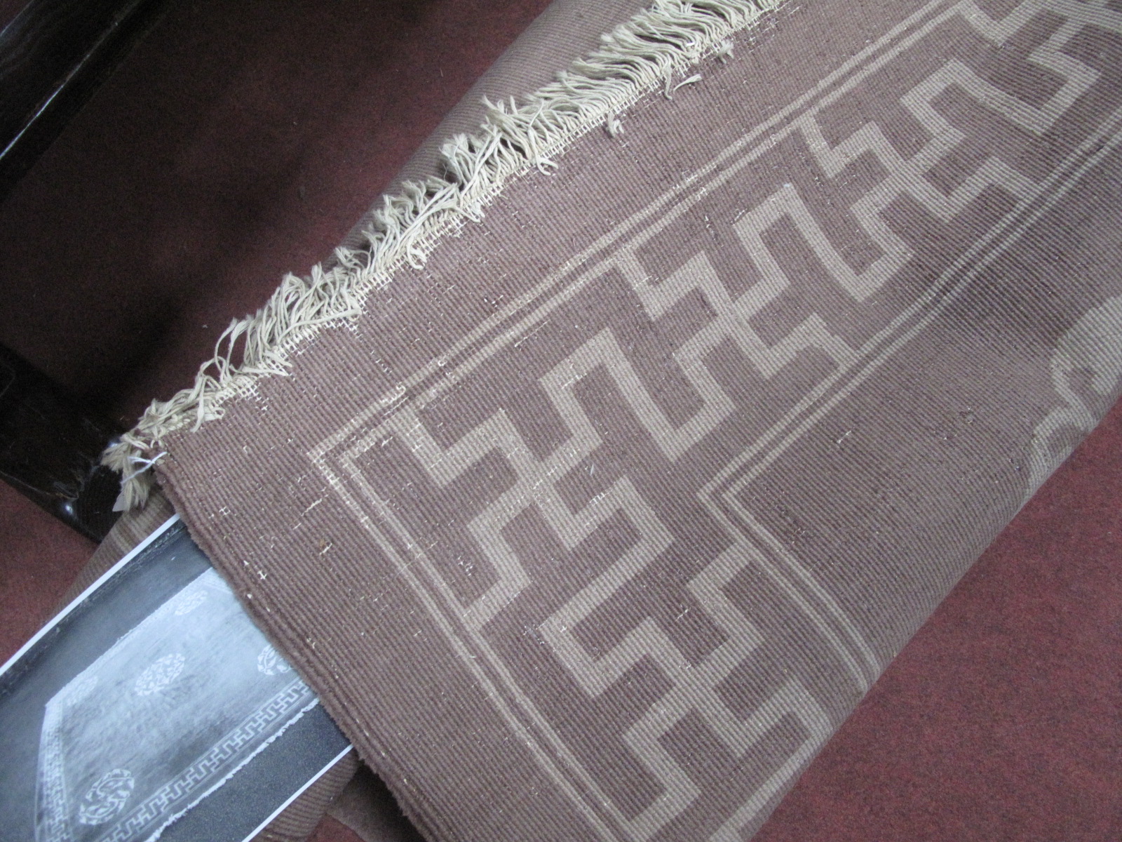 A Chinese Wool Tassled Carpet, with floral motifs, within Swastika border, on brown ground, no - Image 3 of 5