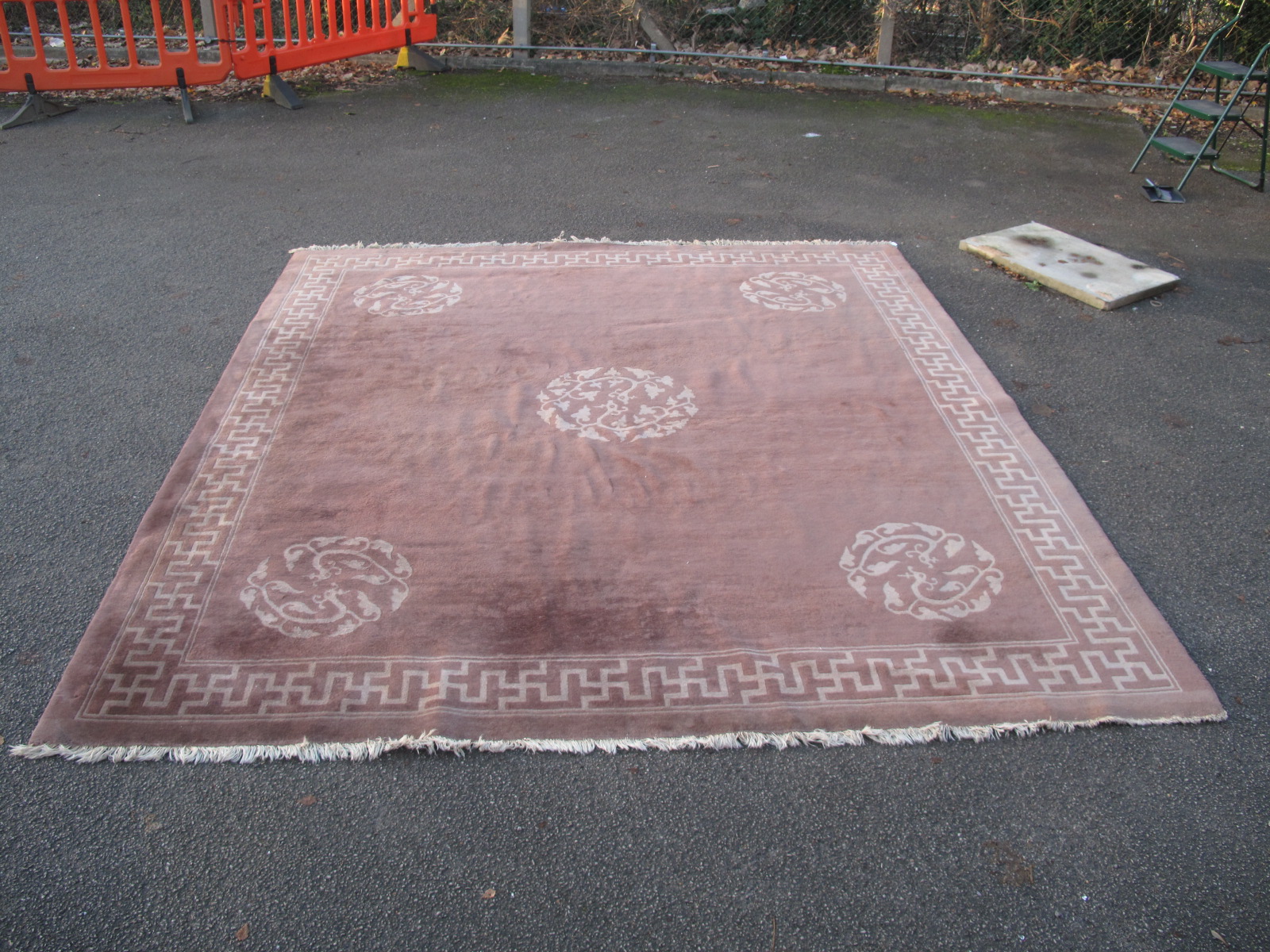 A Chinese Wool Tassled Carpet, with floral motifs, within Swastika border, on brown ground, no - Image 2 of 5