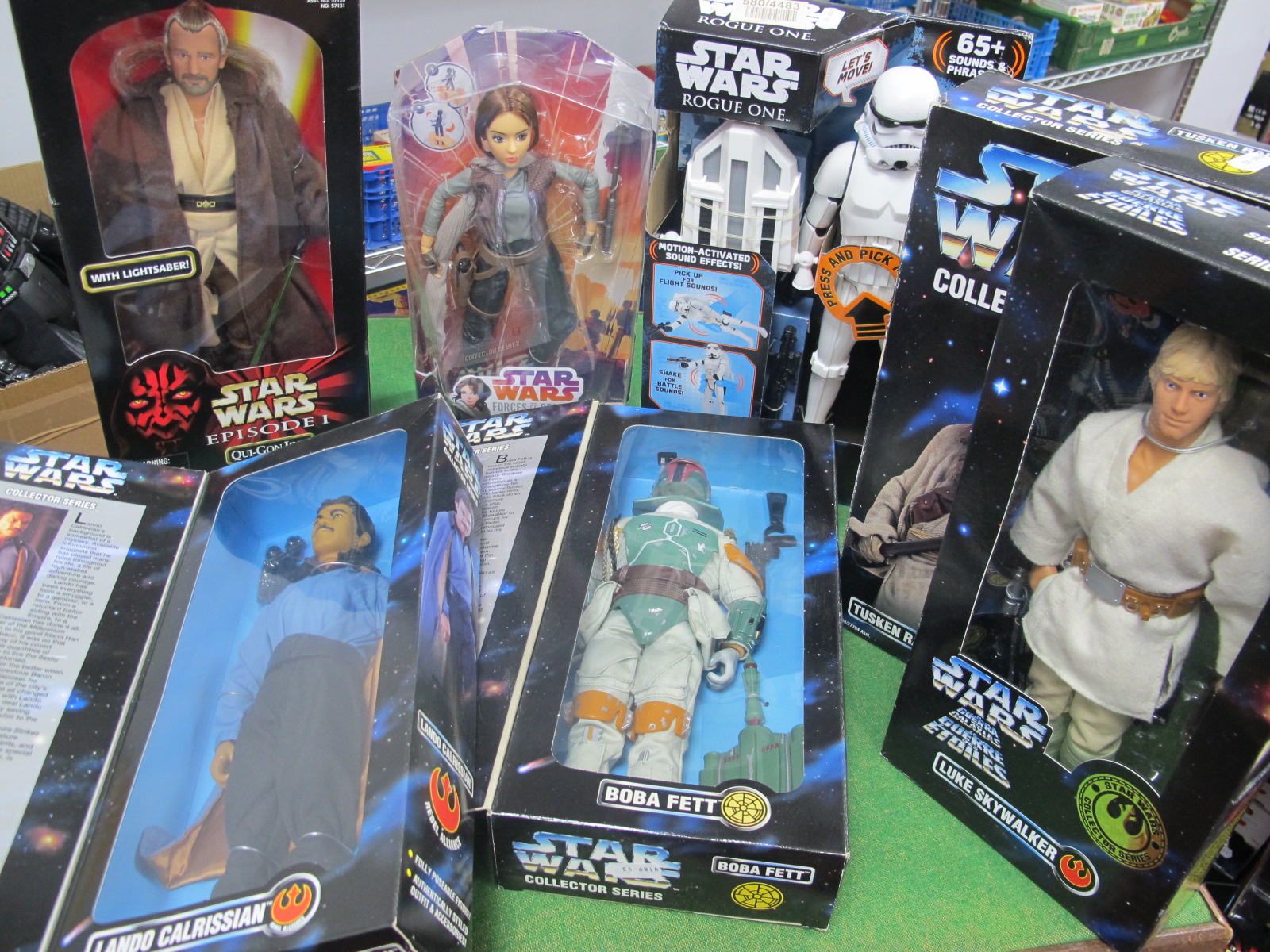 Seven Boxed Star Wars Figures, to include Qui Gon Jinn, Jyn Erso and others.