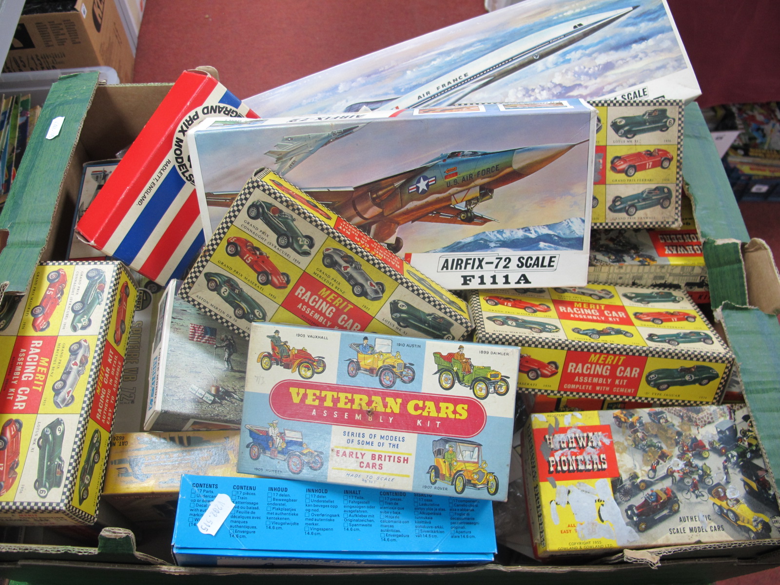 A Quantity of Plastic Model Kit Spare Parts, empty boxes, instruction leaflets together with a