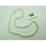 A Modern Single Strand Pearl Bead Necklace, the uniform beads knotted to textured clasp, stamped "