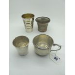 A Hallmarked Silver Mug, together with an American Reed & Barton Sterling small tumbler, a large