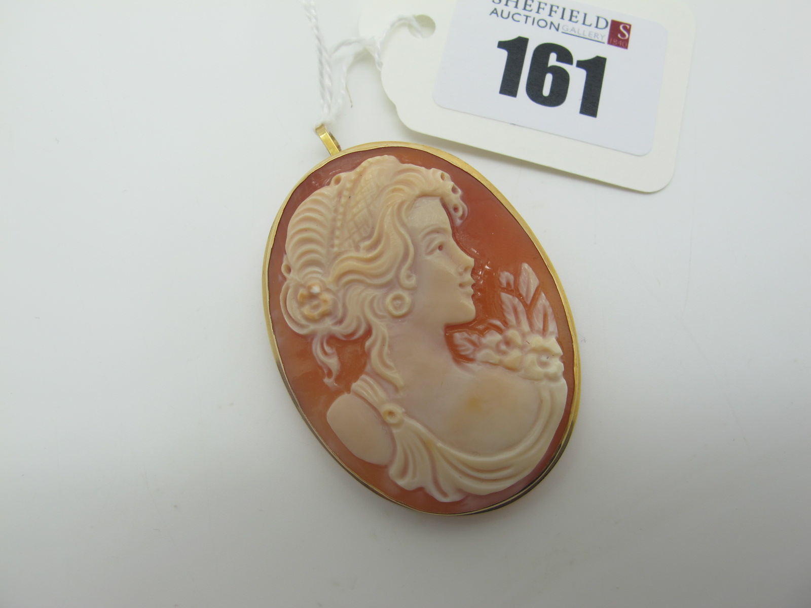 A Modern Large Oval Shell Carved Cameo Brooch / Pendant, depicting female profile, oval collet