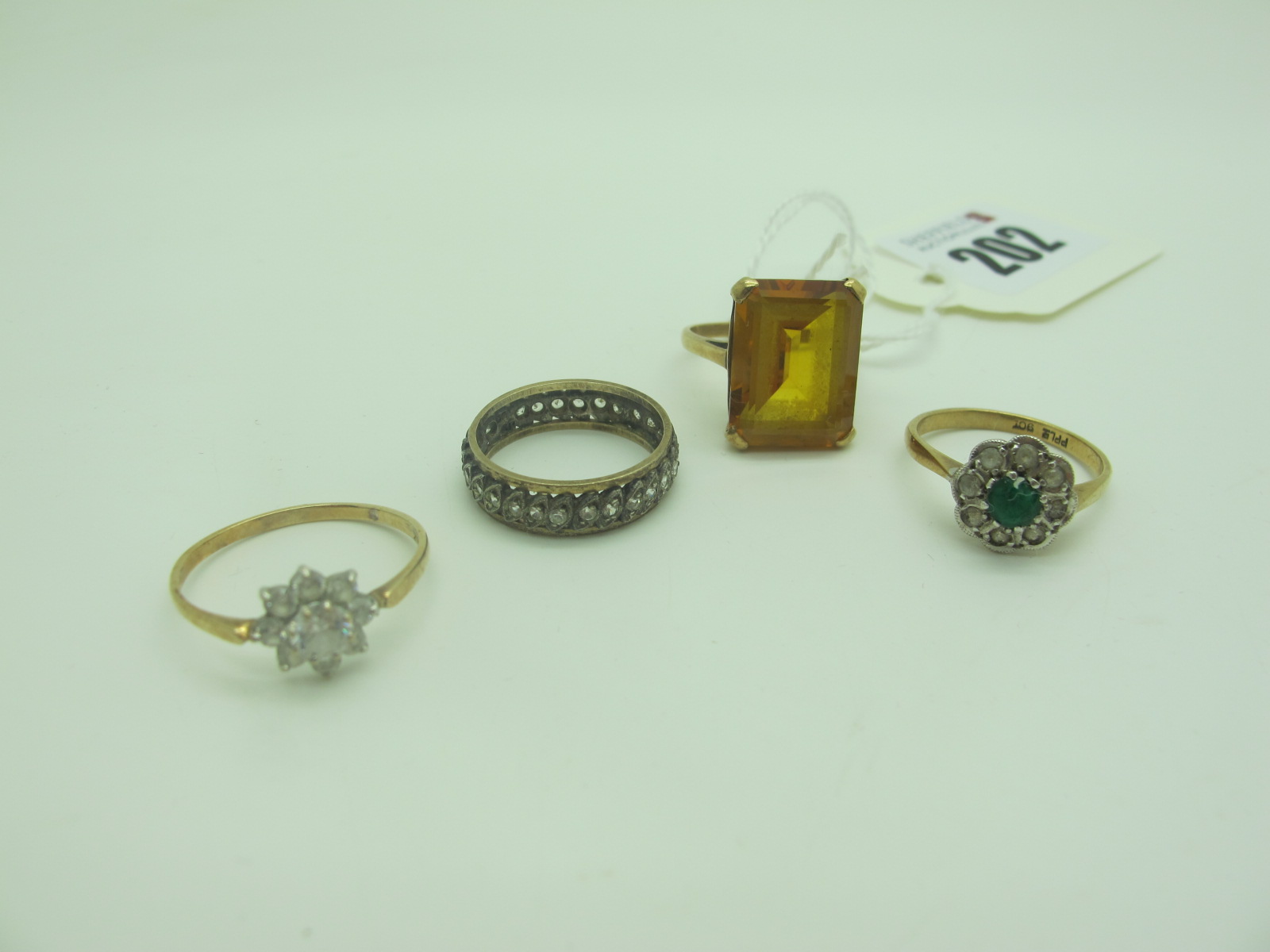 A Large 9ct Gold Single Stone Dress Ring, (finger size N); two cluster rings and an eternity