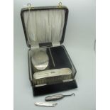 A Hallmarked Silver Backed Brush Set, with engine turned decoration, in original fitted case (