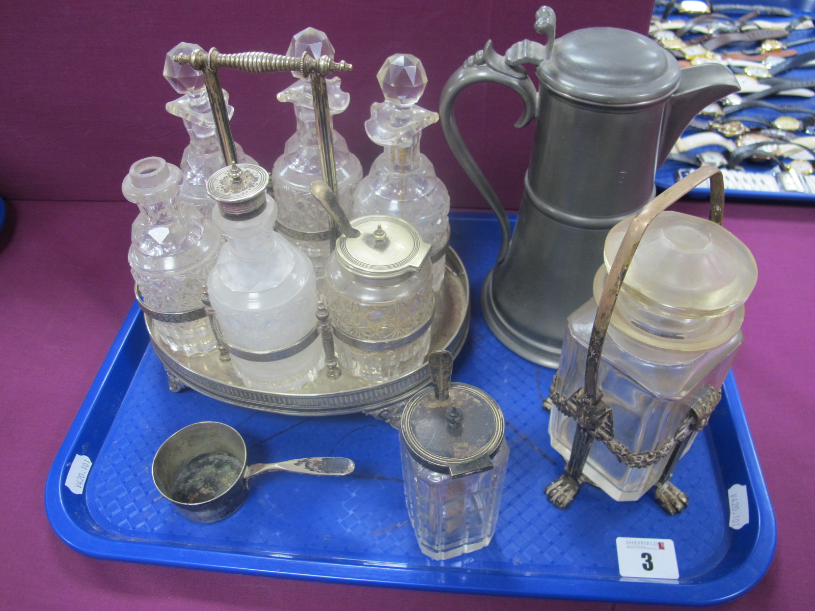 A Decorative Plated Condiment Stand, fitted with cut glass jars and bottles; together with a