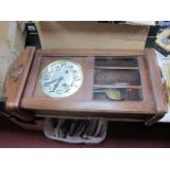 A 1940's Mahogany Wall Clock, with a silver dial, Arabic numbers, shaped base, 65cm wide.