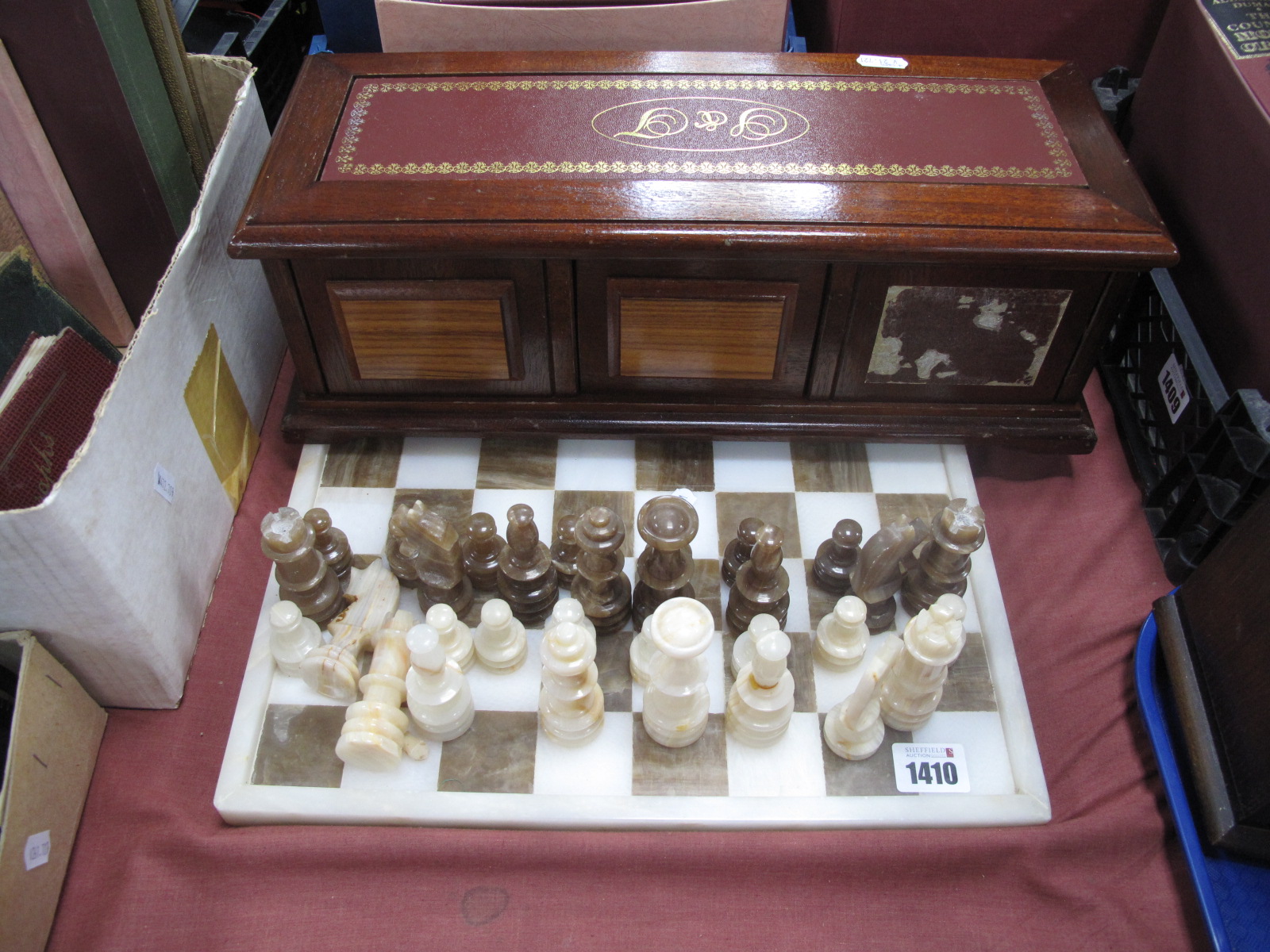 An Alabaster Chess Set, with board, compendium of games in box.