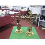 Pair of Heavy Brass Candelabra, each with four drip cups to twin branch, lion finial, ringed support